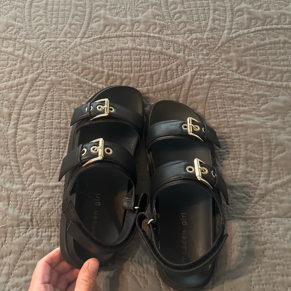 Madden Girl. Size 6.5. Fits like 7. Black with gold buckles and Velcro closure